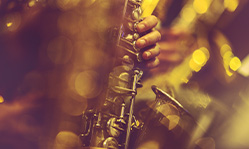 creative closeup photo of someone playing a saxophone with a lot of bokeh effect